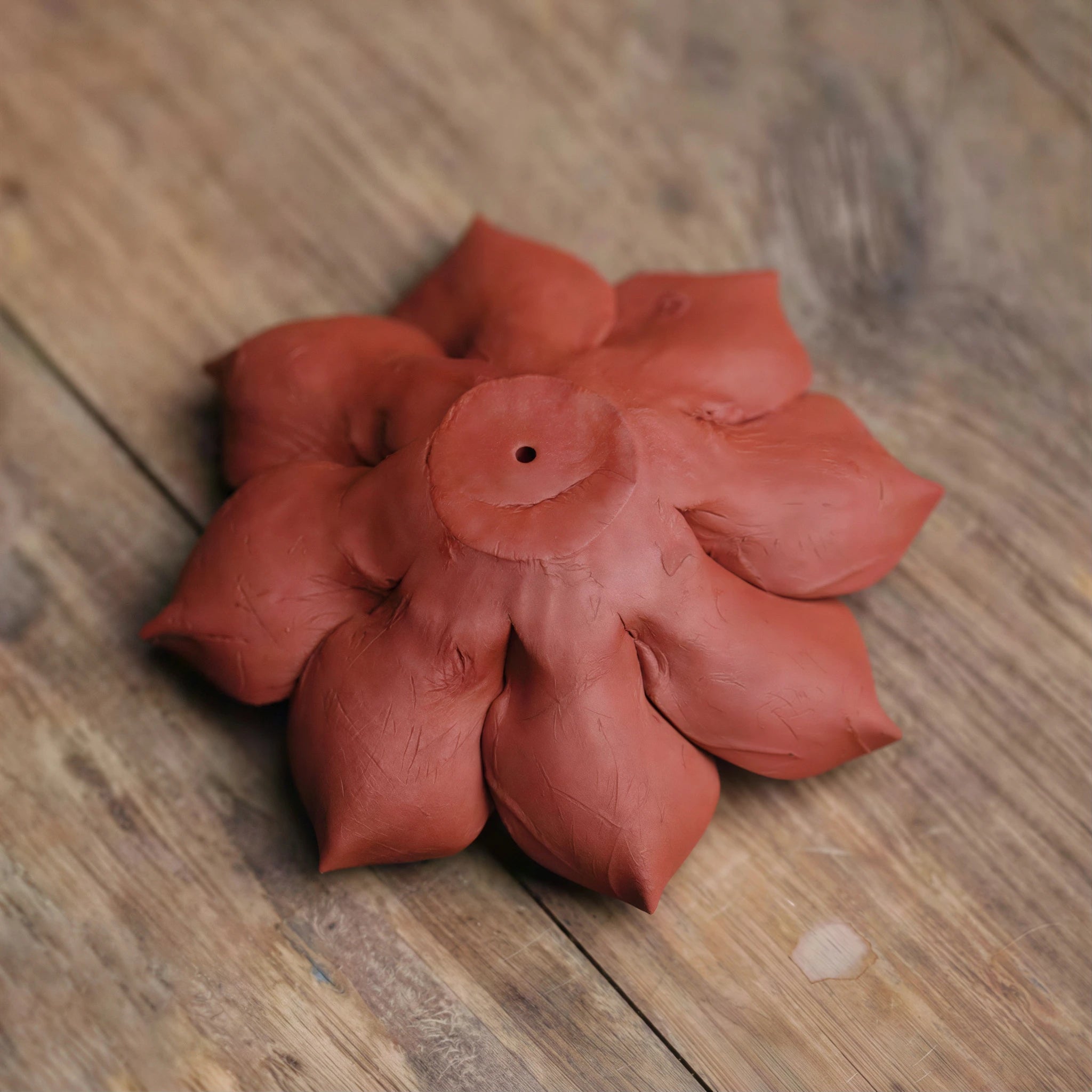 Underside of the unglazed Zhuni botanical incense holder