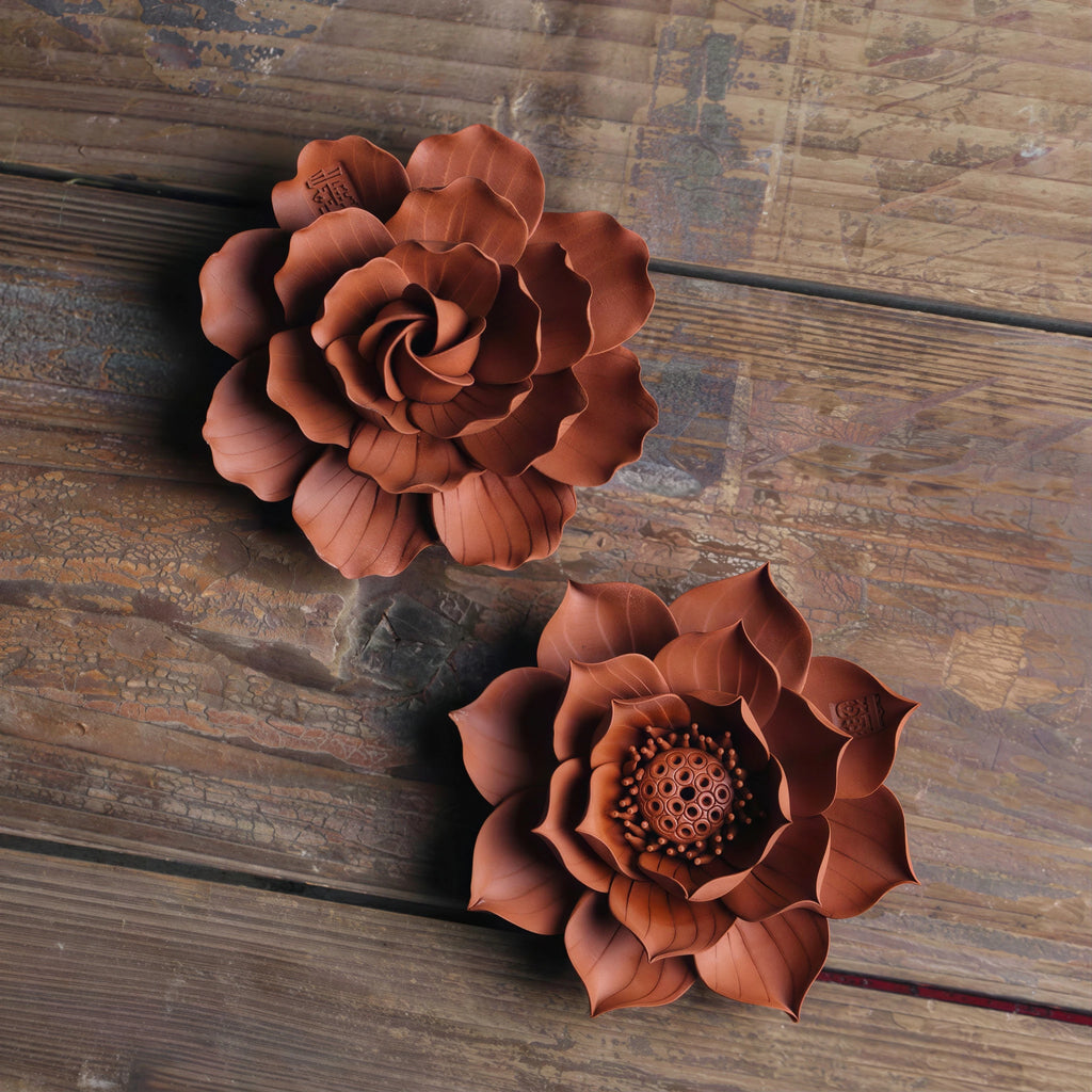 Lotus and camellia Zhuni incense holder variants shown together