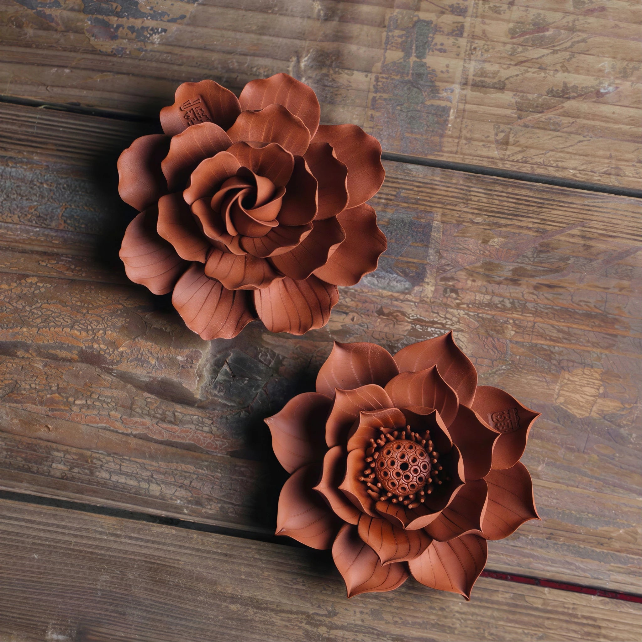 Lotus and camellia Zhuni incense holder variants shown together