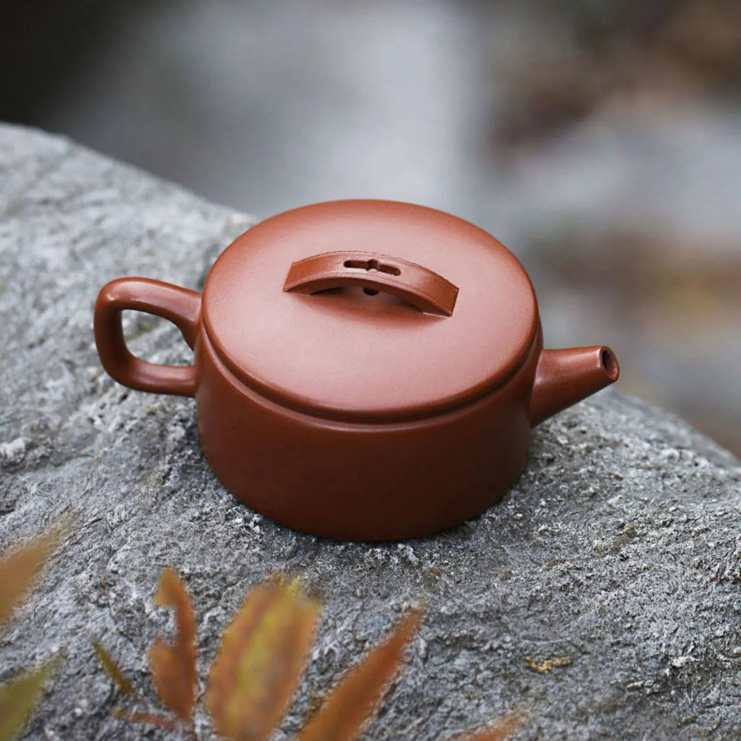 Unglazed zini Hanwa teapot on natural stone