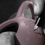 Lotus motif being carved into the zini teapot body