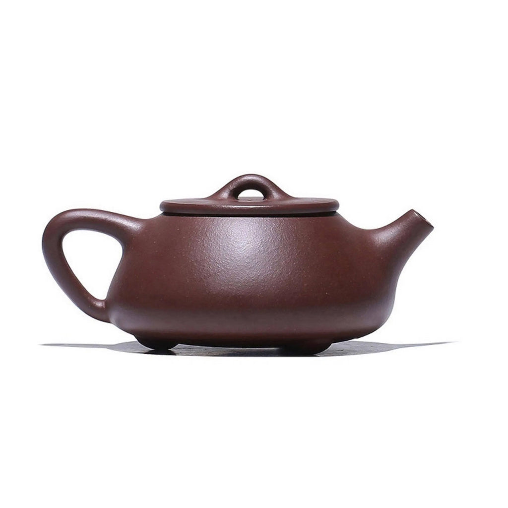 Angled view of the carved lotus Shipiao teapot
